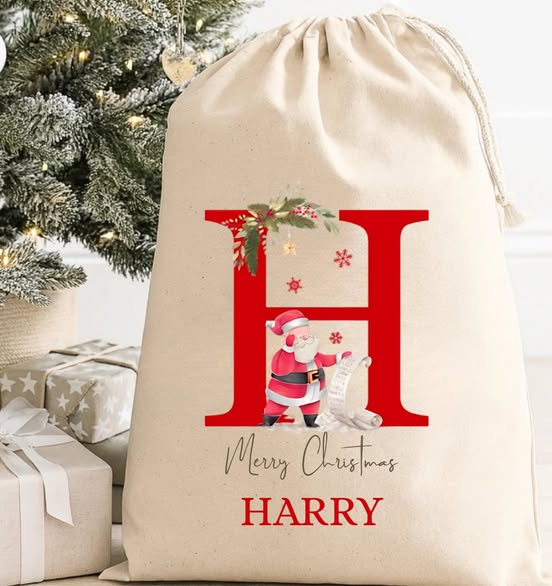 THESE PERSONALISED CANVAS DRAWSTRING CHRISTMAS SACKS